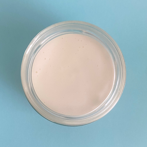 Jar of moisturising cream for body, hand and face. Internal contents.